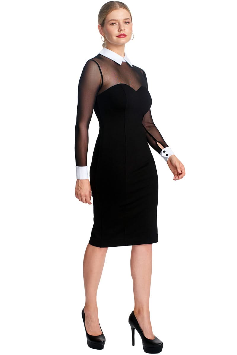 Woman in fitted black midi dress with sheer sleeves and white collar and cuffs.