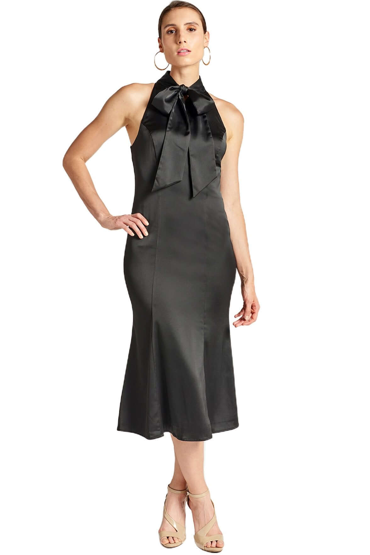 Model wearing black stretch satin sleeveless midi dress with pussy bow necktie and mermaid hem.Eloise Dress