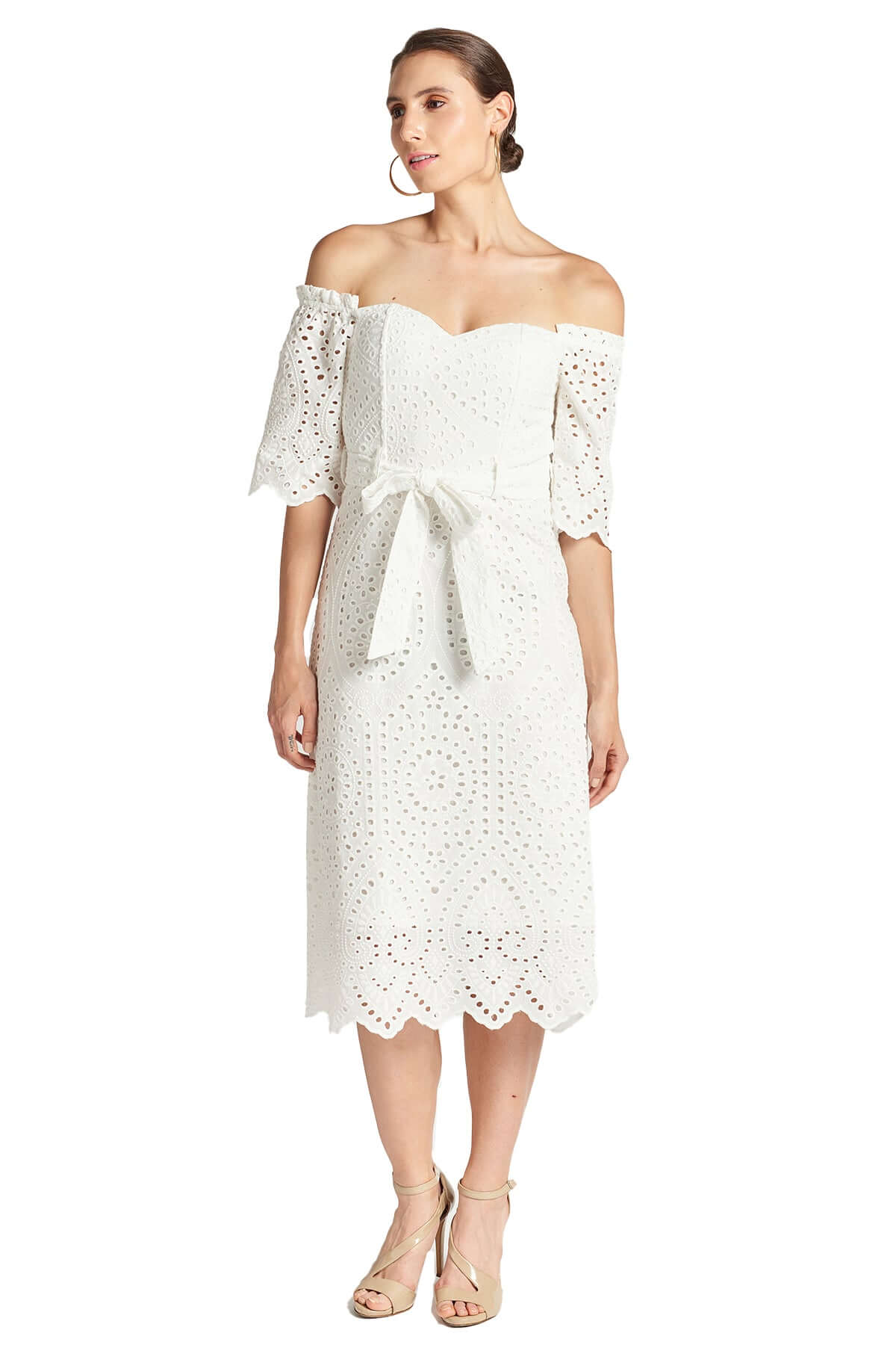 Front view of model wearing the Simona Maghen Jasmine Dress, white cotton scalloped eyelet midi a-line dress with off the shoulder sweetheart neckline, self belt, and short sleeves.
