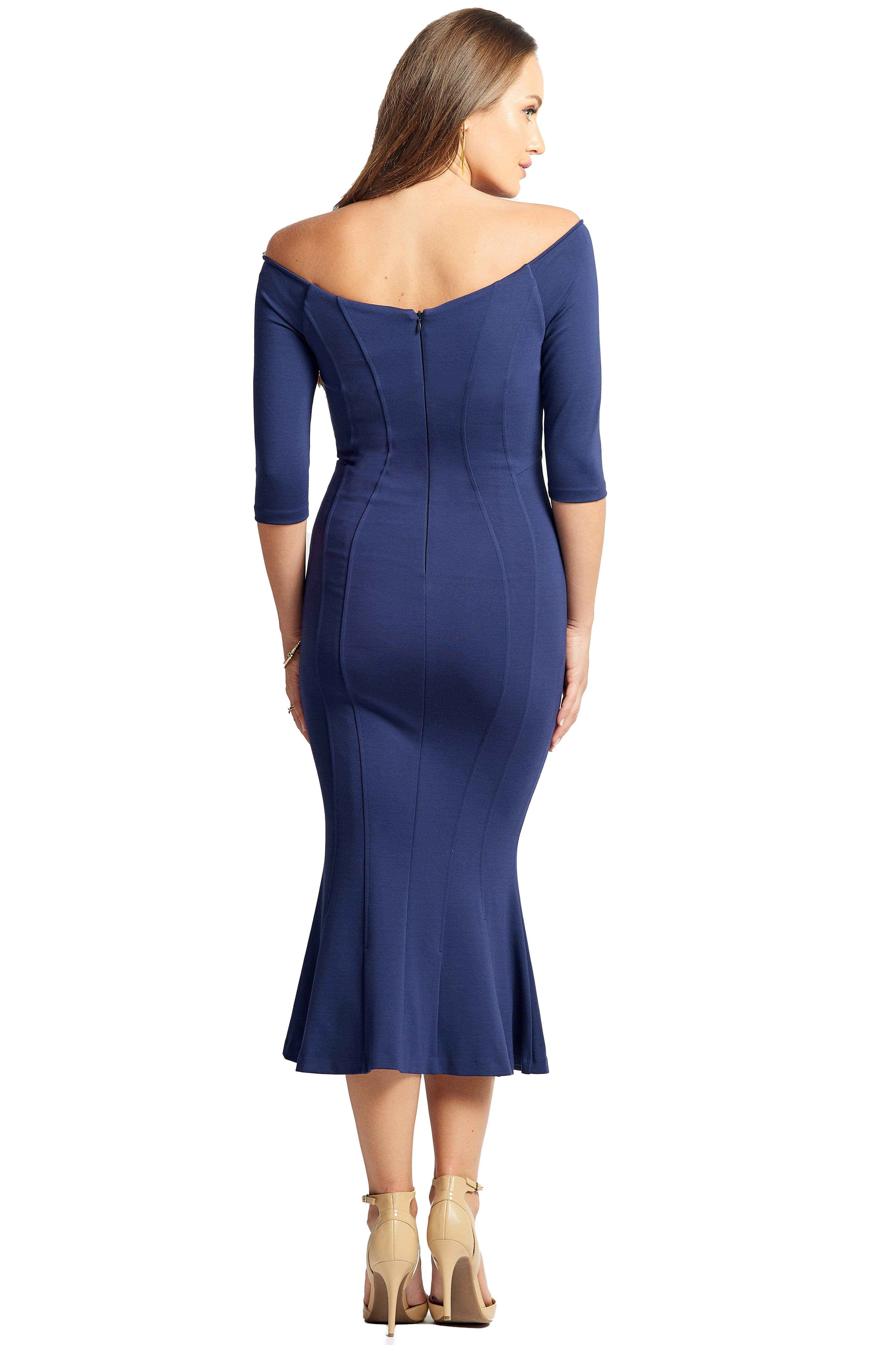 Back view of model wearing the Simona Maghen Raquel Dress, navy knit Ponte midi body con dress, with off the shoulder sweetheart neckline, 3/4 sleeves & mermaid hem.