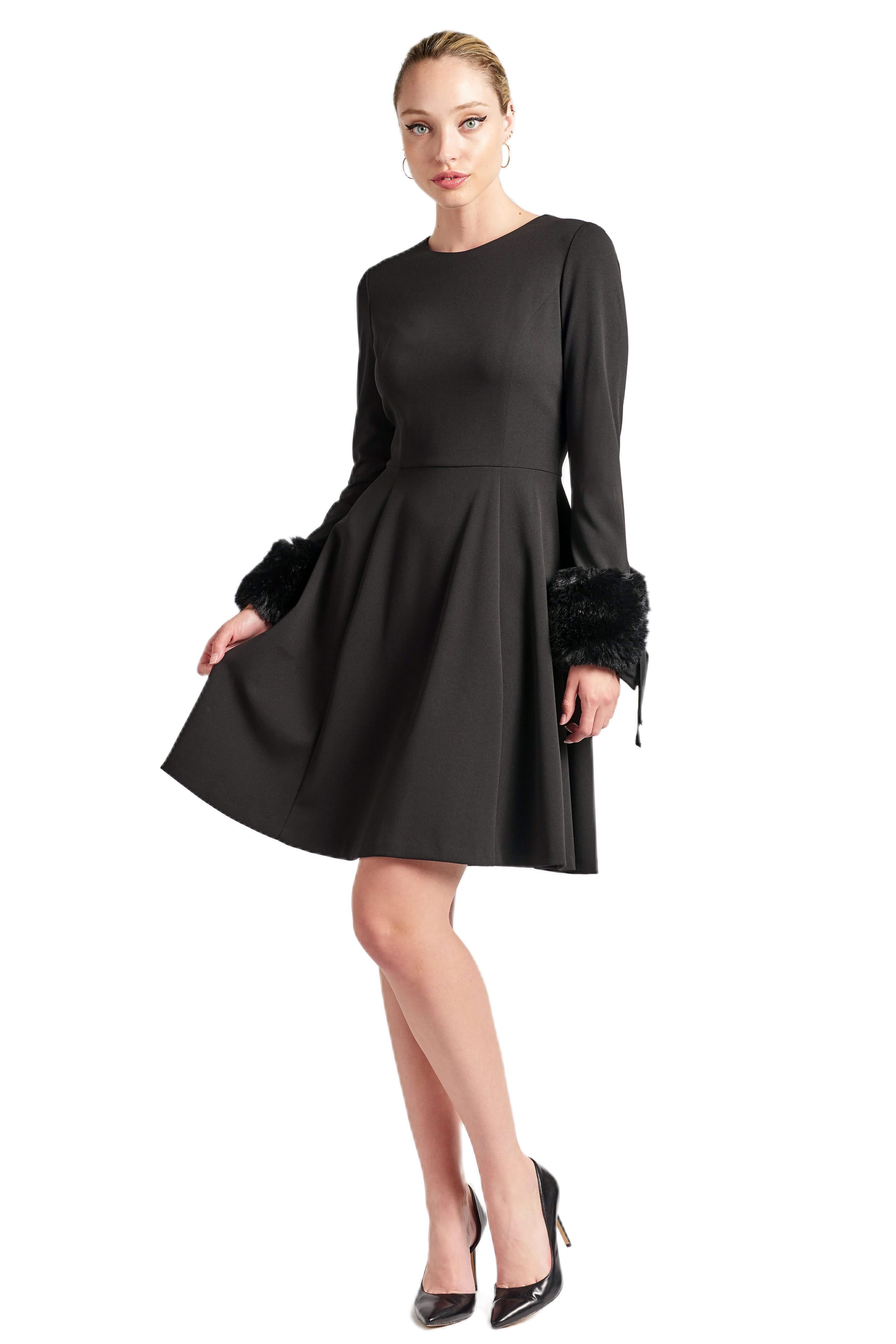 Black fit & flare dress with long sleeves and faux fur cuffs, worn by a model.