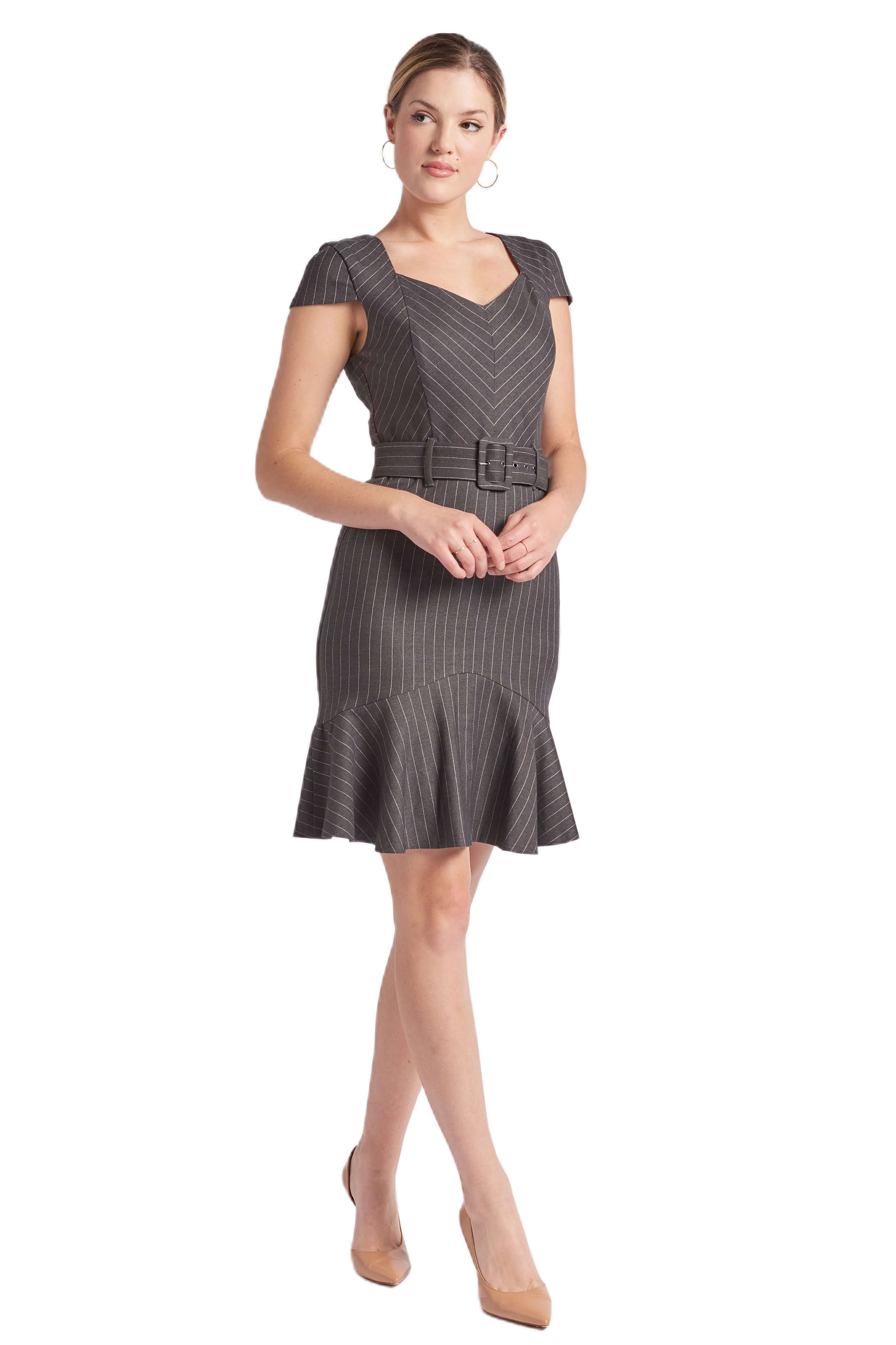 Charcoal pinstripe dress with cap sleeves, self-belt, and ruffle hem on a model. Knee-length.