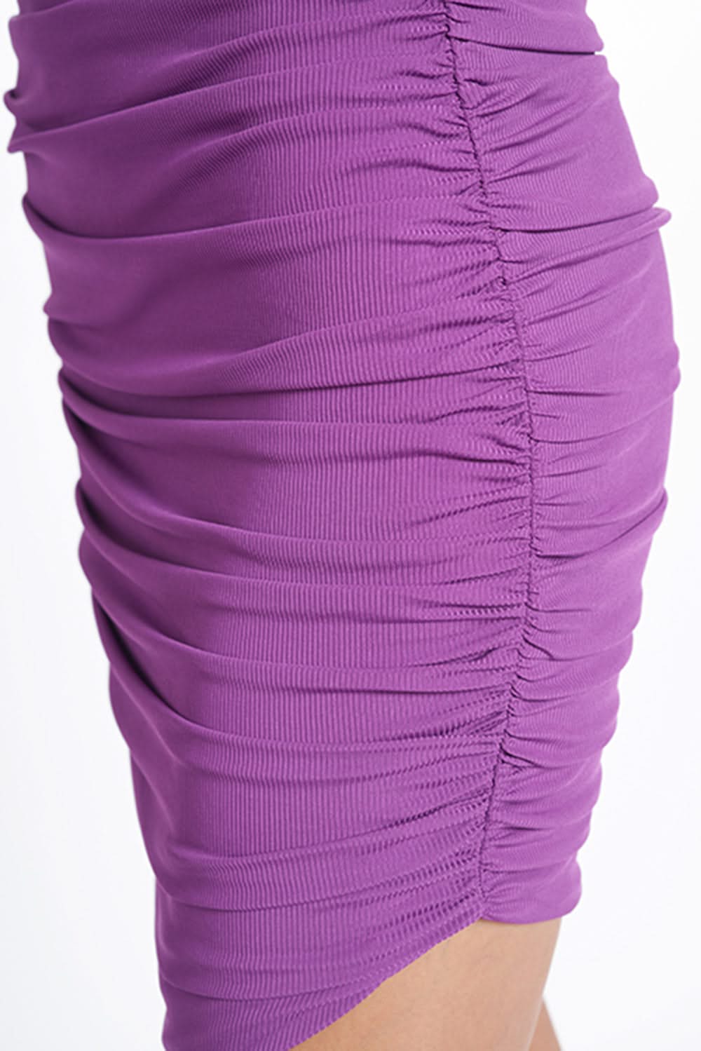 Close-up of a ruched purple ribbed dress.
