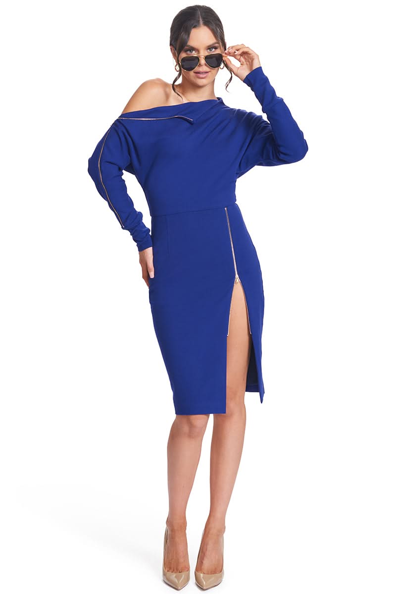 Front view of model wearing the Simona Maghen Josefa Dress, royal blue long sleeve Ponte midi dress with zipper along the right shoulder and front skirt zipper slit, accessorized with a pair of aviator sunglasses.