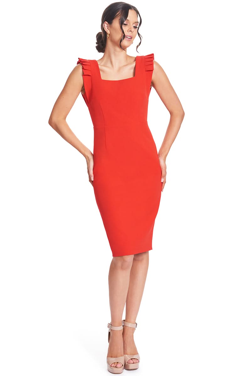Model wearing Simona Maghen Monarch red sheath dress with square neck and pleated arm openings.