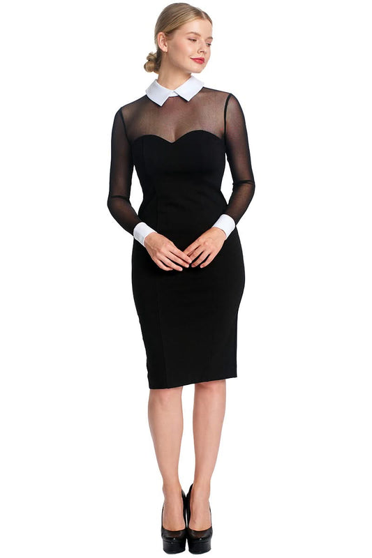 Woman in black midi dress with sheer sleeves and white collar and cuffs, wearing black platform heels.