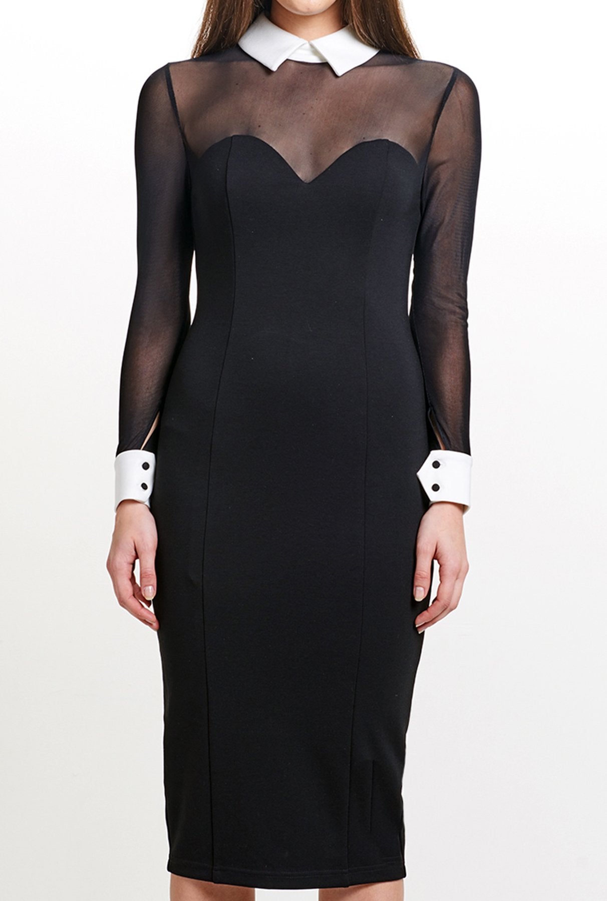 Close-up view of model wearing black knit Ponte midi tuxedo dress, with contrast mesh long sleeves & white collar and cuffs.