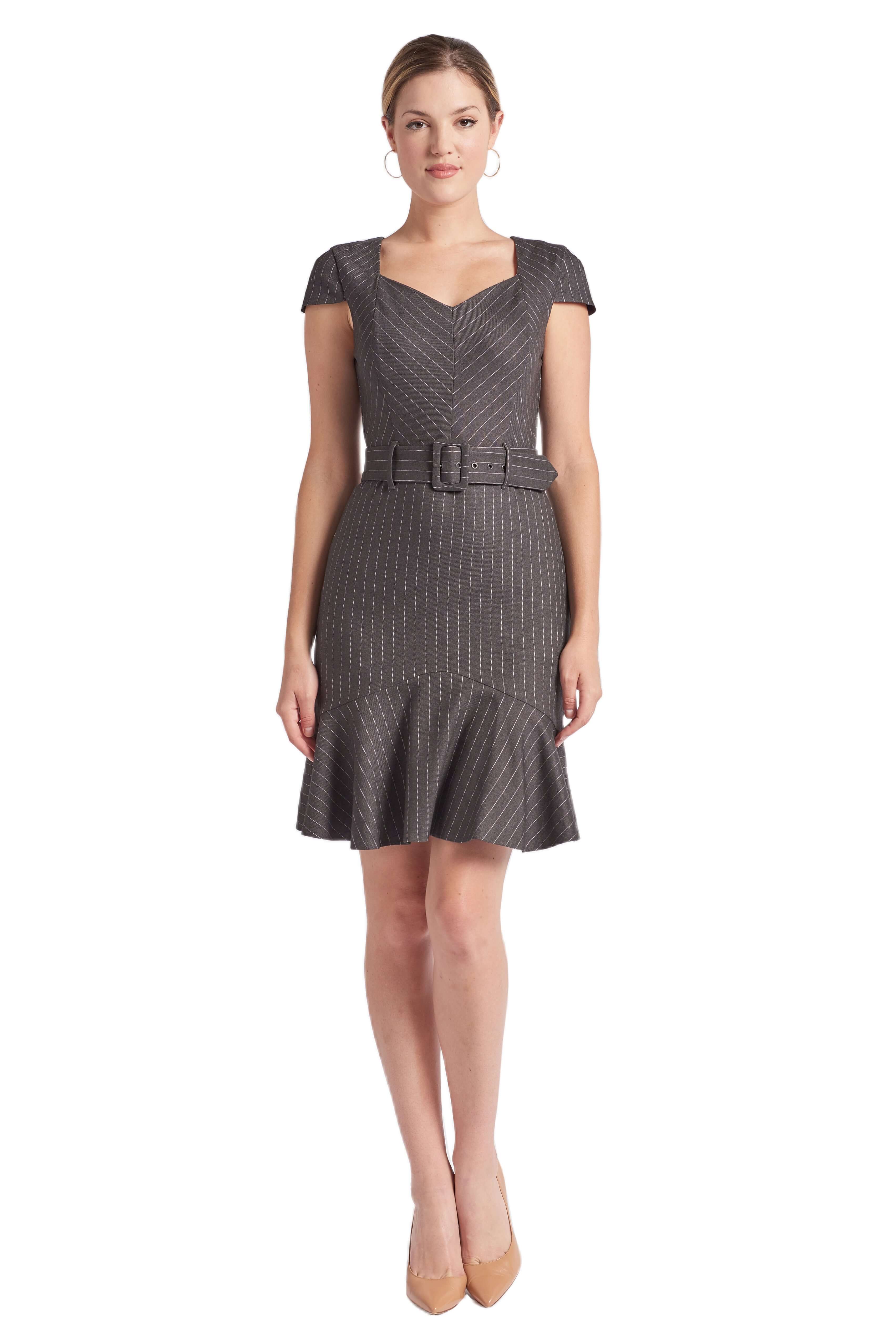Model wearing charcoal pinstripe above the knee dress with cap sleeves, self belt and ruffle hem.