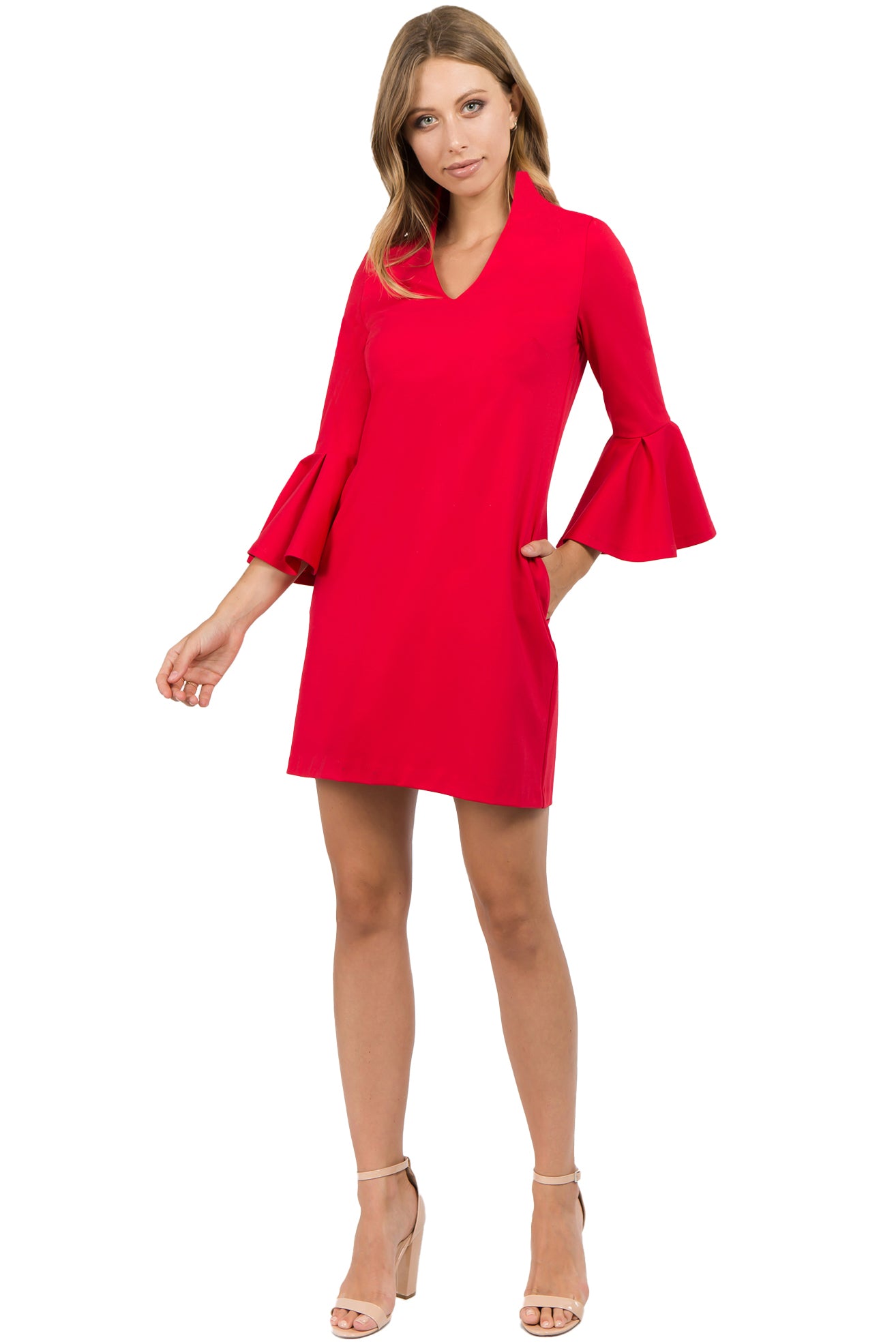 Model wearing red knit Ponte mini shift dress with v-neckline, 3/4 bell sleeves and side slit pockets.