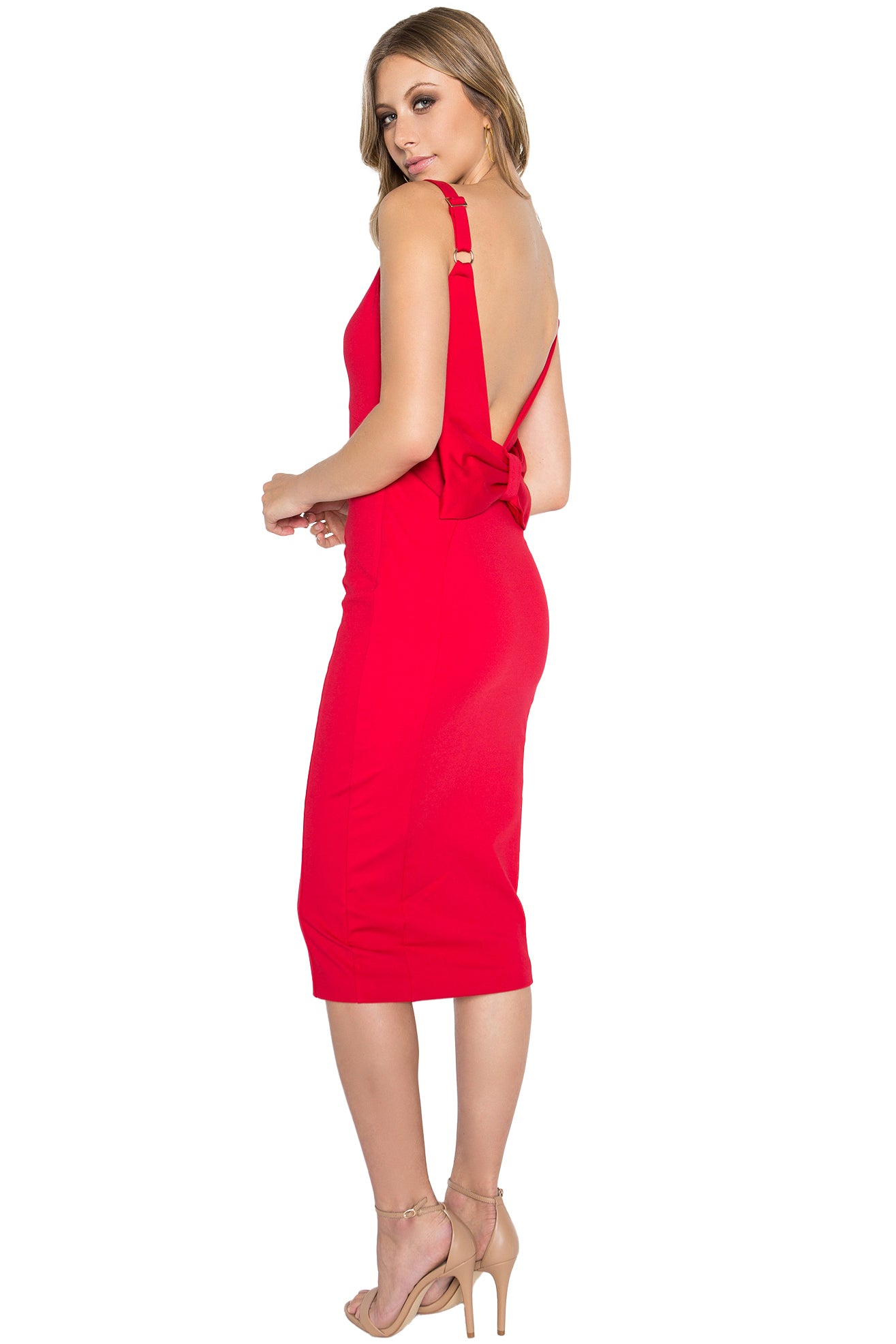 3/4 back view of model wearing the Simona Maghen Homa Dress, red midi knit Ponte sleeveless dress with adjustable straps, sweetheart neckline, low back, and large bow at back waist.