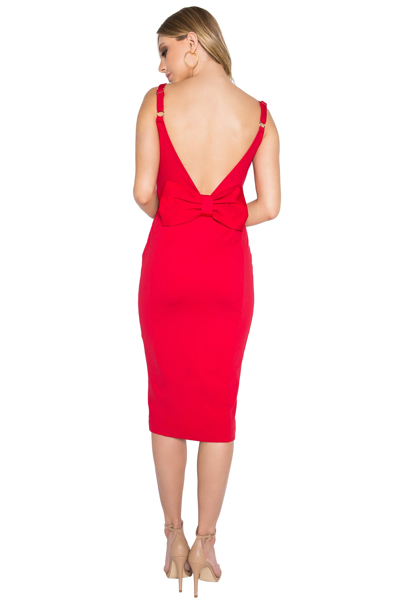 Back view of model wearing the Simona Maghen Homa Dress, red midi knit Ponte sleeveless dress with adjustable straps, sweetheart neckline, low back, and large bow at back waist.
