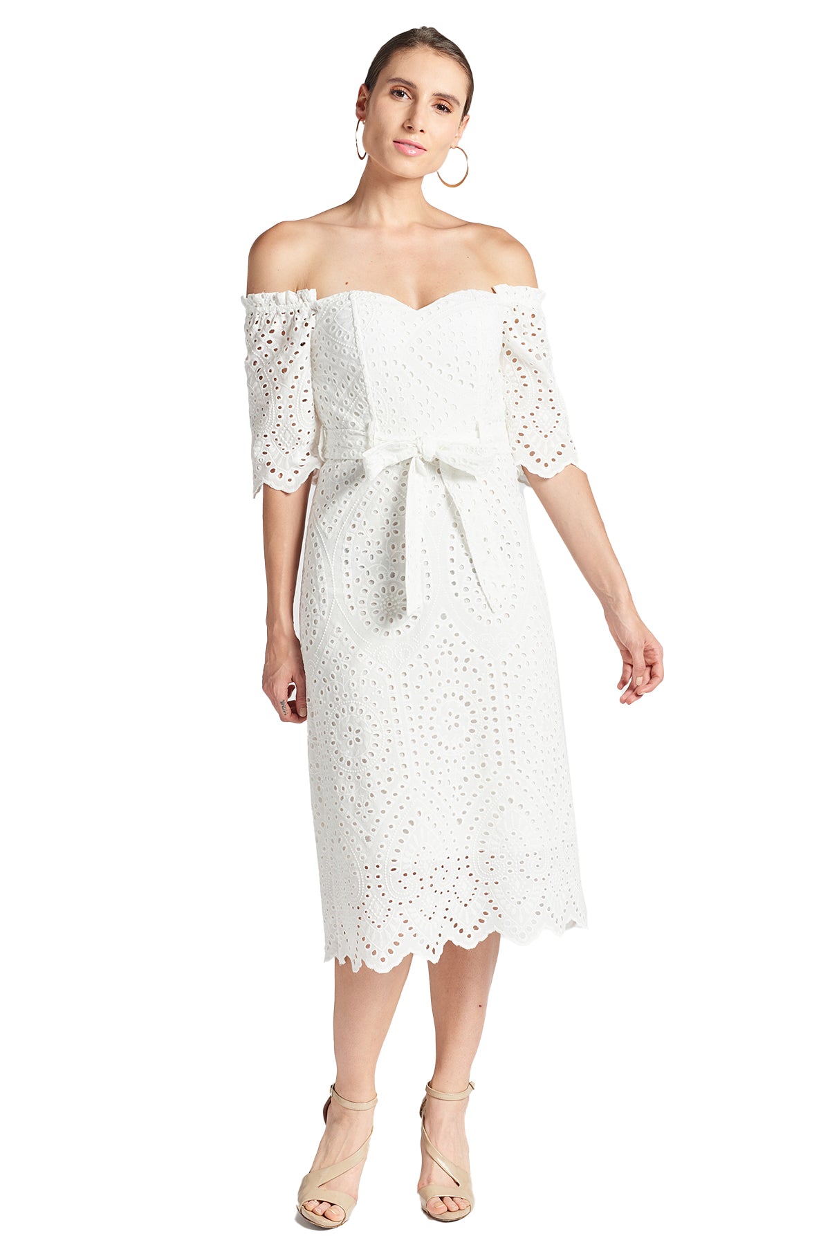 Front view of model wearing the Simona Maghen Jasmine Dress, white cotton scalloped eyelet midi a-line dress with off the shoulder sweetheart neckline, self belt, and short sleeves.