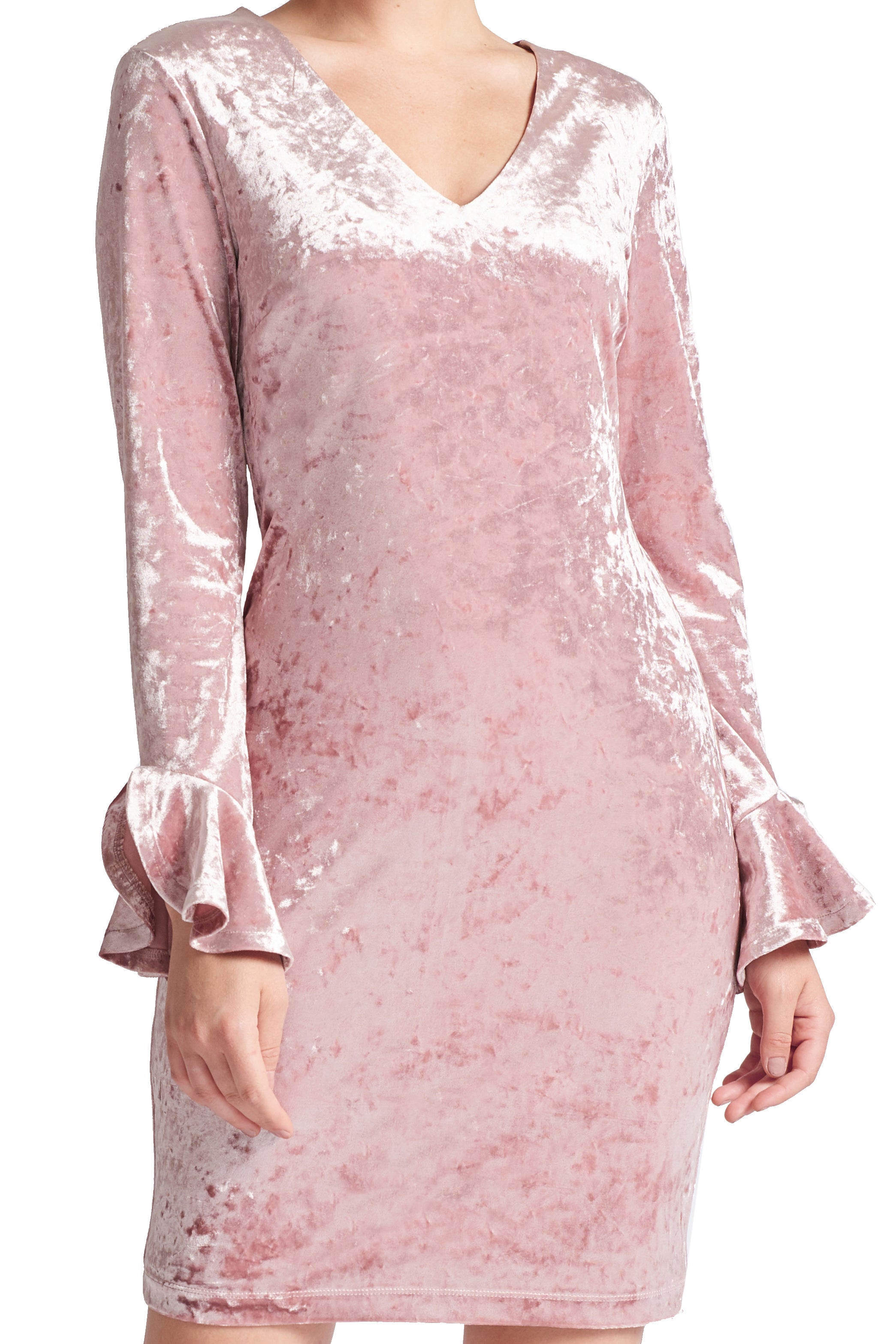 Close-up view of model wearing the Simona Maghen Kara Dress, blush pink stretch velvet short dress with v-neckline, long sleeves & bell sleeves.
