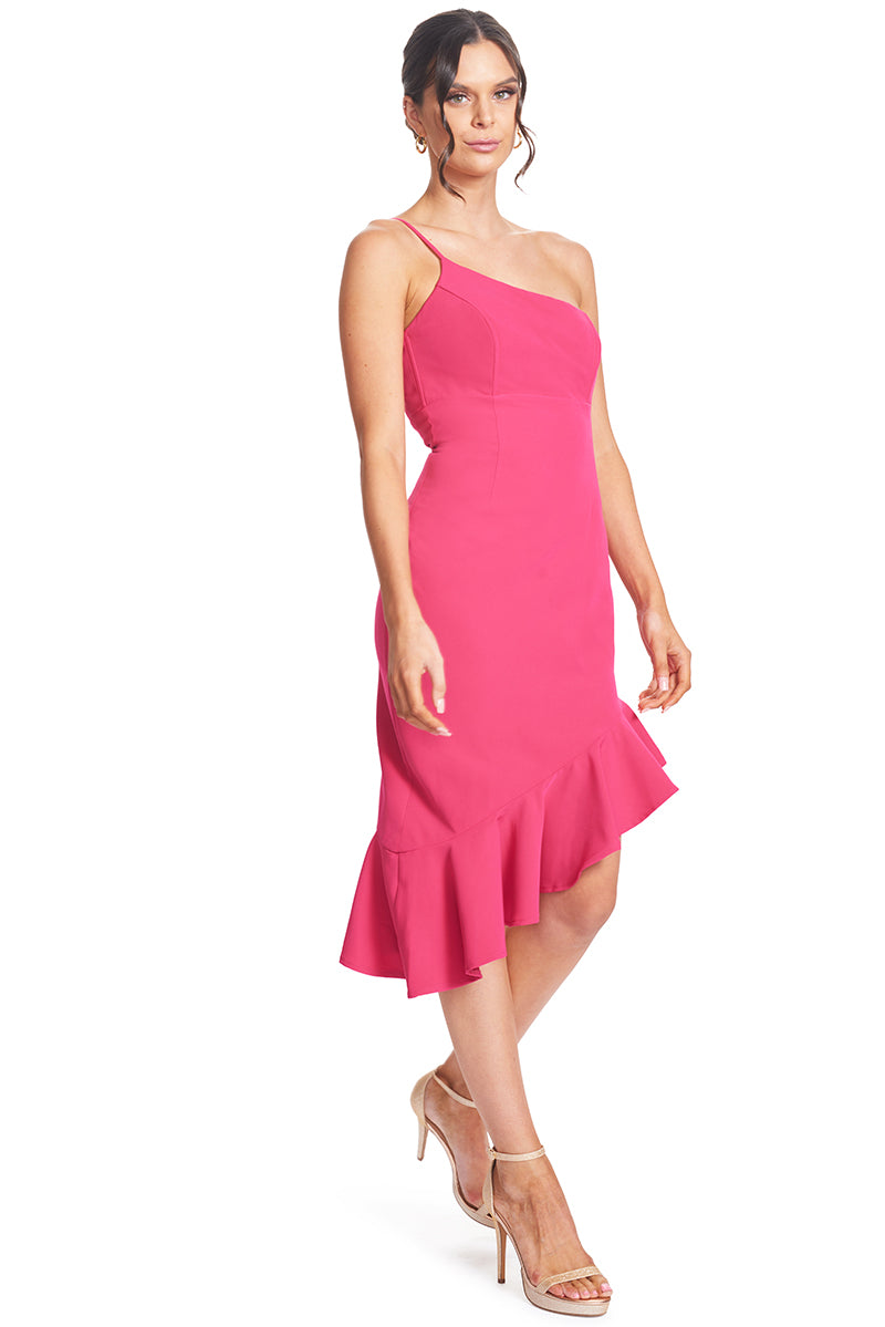 3/4 front view, with lower end of hem shown, of model wearing the Simona Maghen Rufflin' Round Dress in fuchsia, one shoulder adjustable spaghetti strap, structured bodice with boning and bra cups, and an asymmetric ruffle hem.