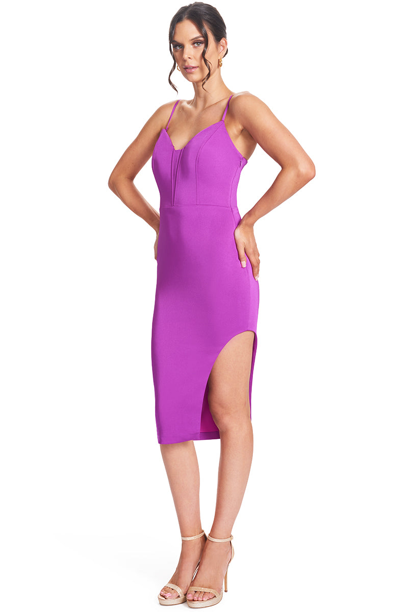 3/4 front view of model wearing the Simona Maghen Va Va Voom Dress, magenta satin midi doby-con dress with pointed bodice, removable straps and left side skirt cut-out.