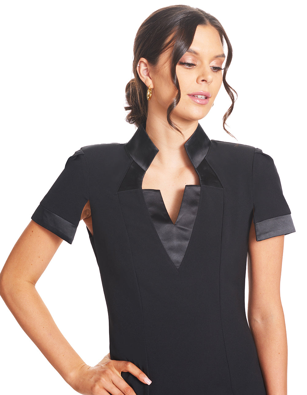 Close-up front view of model wearing the Simona Maghen Top Notch Dress, notch neck high collar poly/spandex crepe sheath dress with split cap sleeves and satin contrast bands.