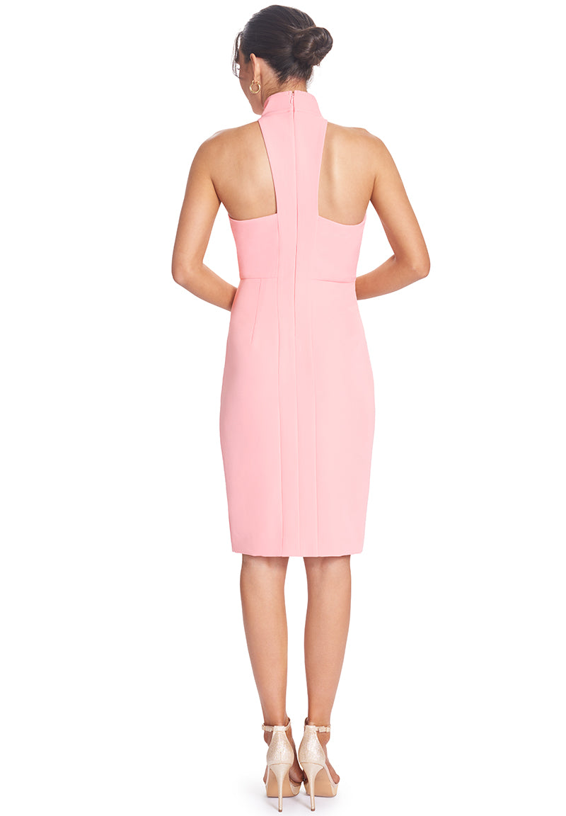 Back view of the Simona Maghen Exhault Dress, in flamingo pink, shoulder baring notch neck racer back midi dress with a front thigh high slit on the left thigh.