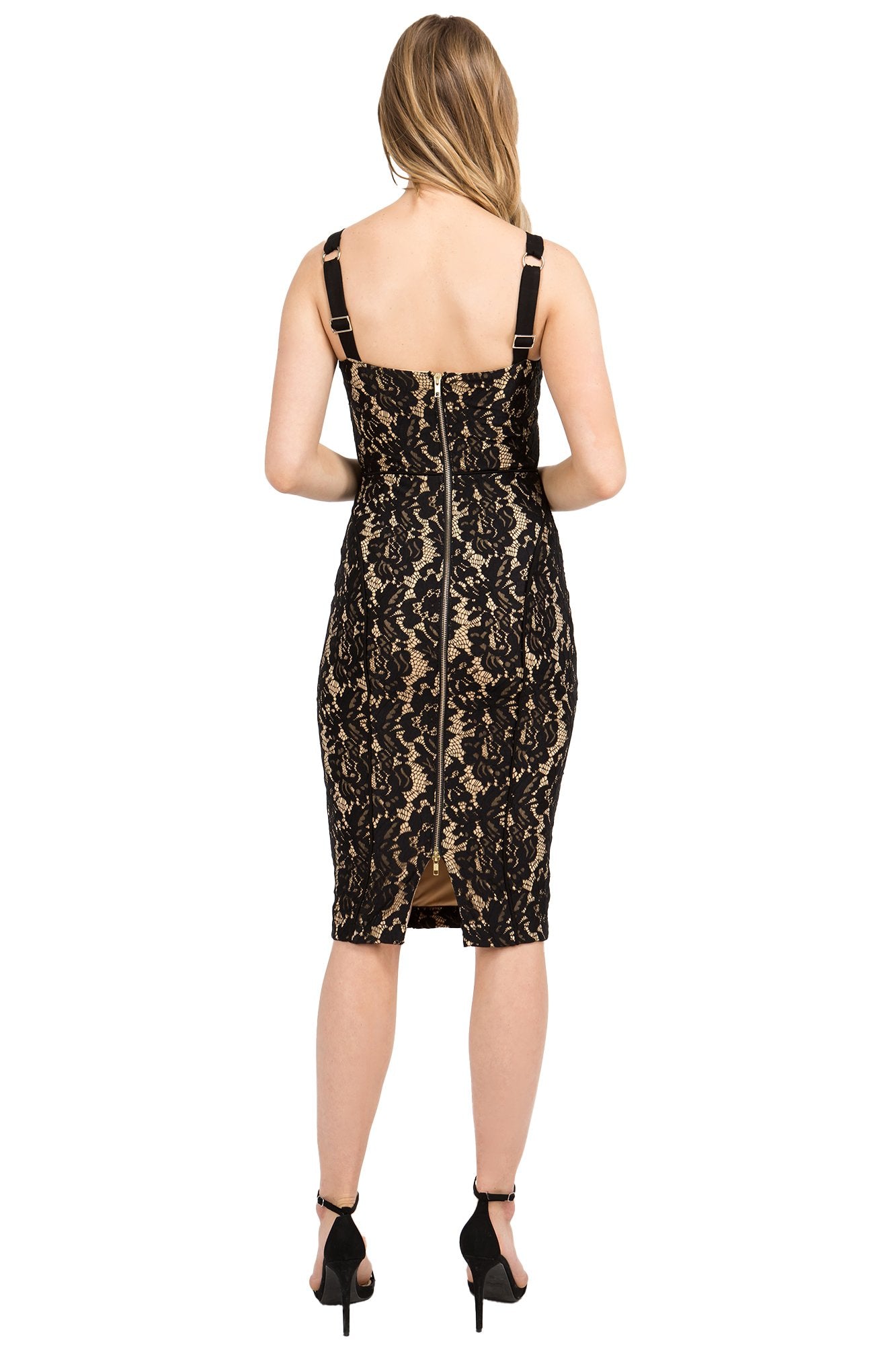 Back view of model wearing body-con midi black lace dress with adjustable straps and gold zipper down center back.